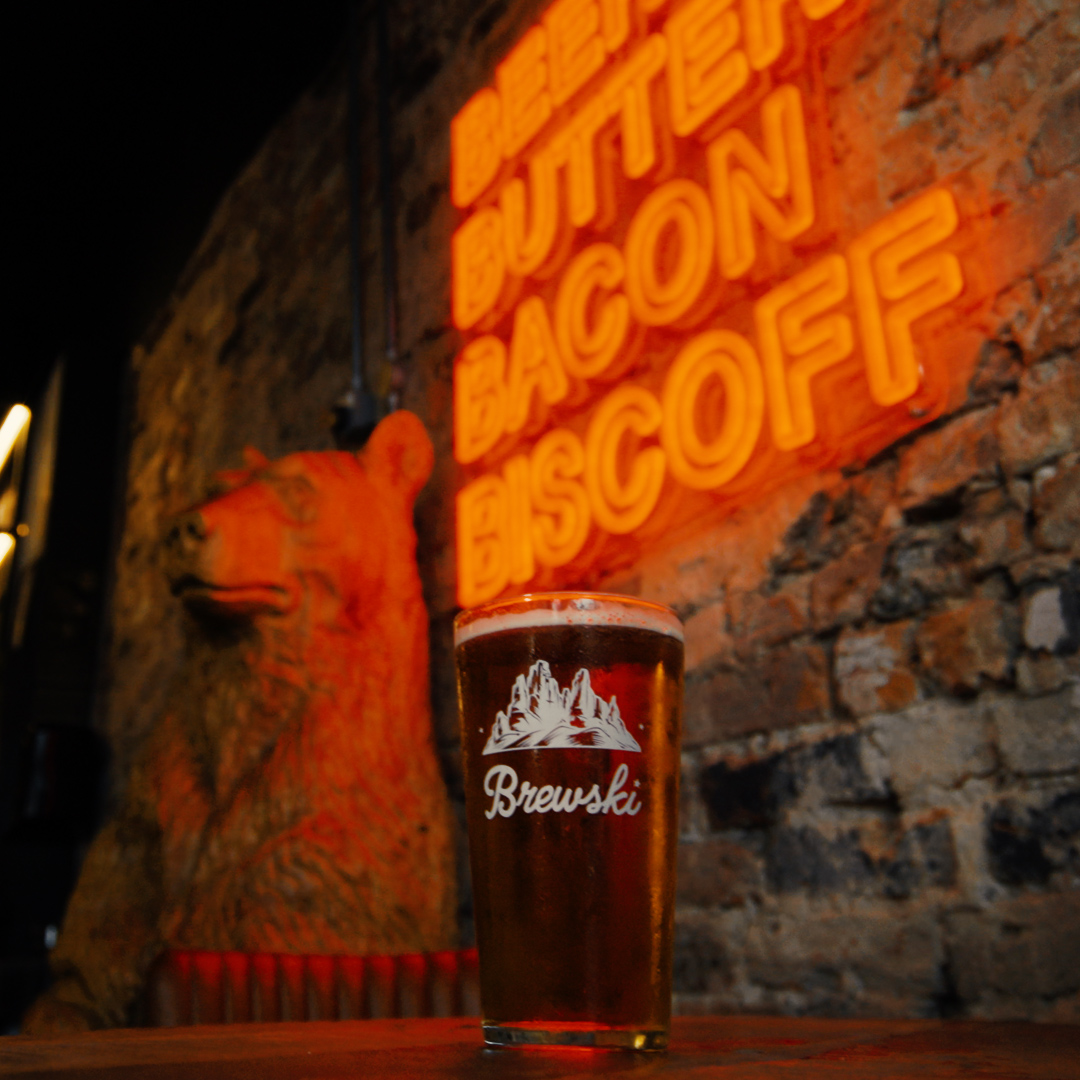 Craft beer poured behind the bar